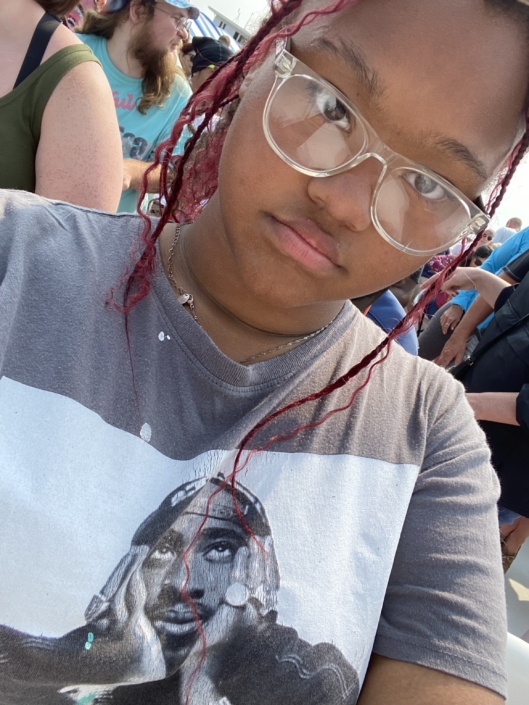 Image Description: A selfie of Ja'Nyiah Thorns. They're wearing glasses and a t-shirt.